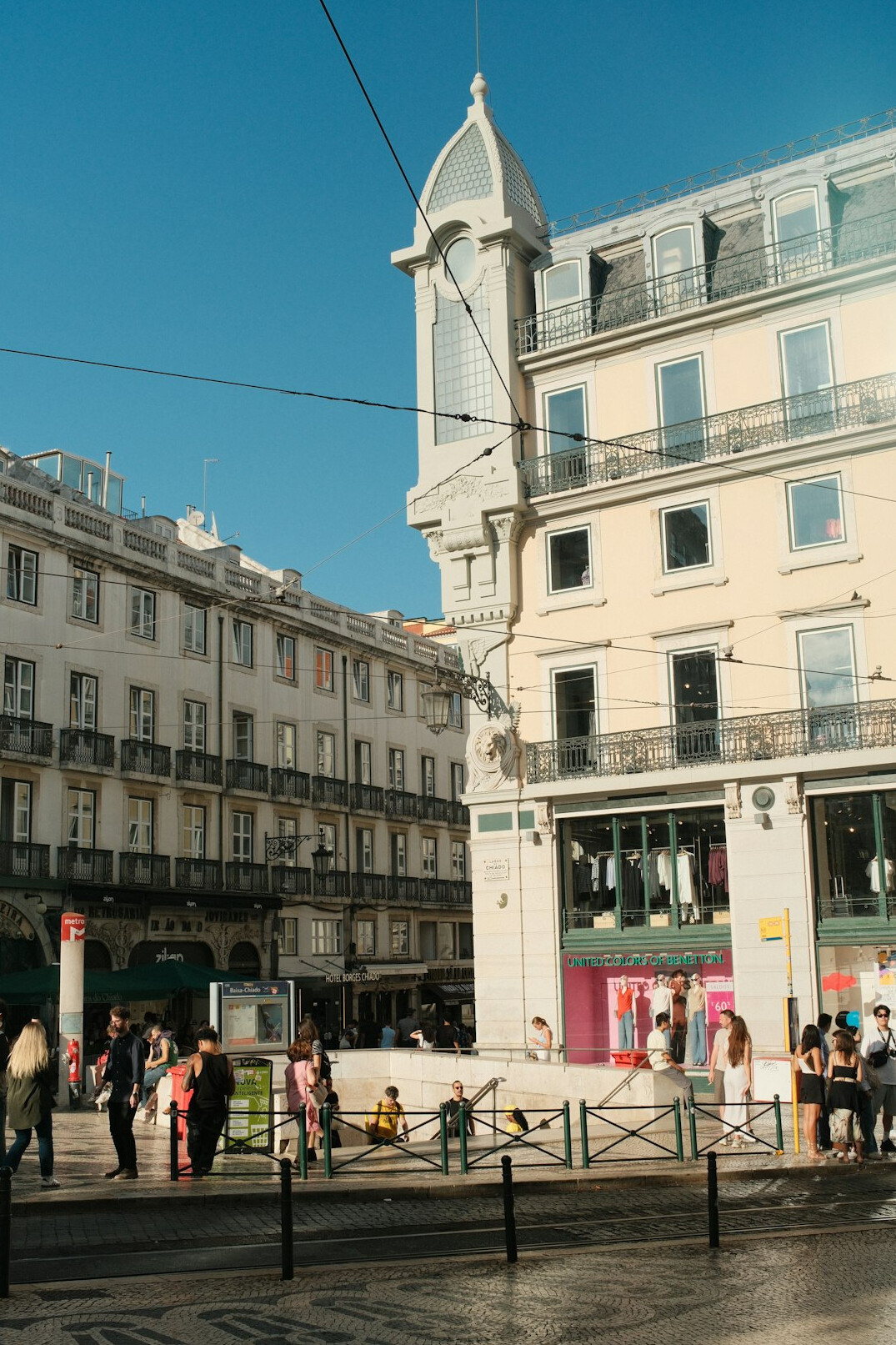 Crowd of anonymous people seen from a distance in an urban public square