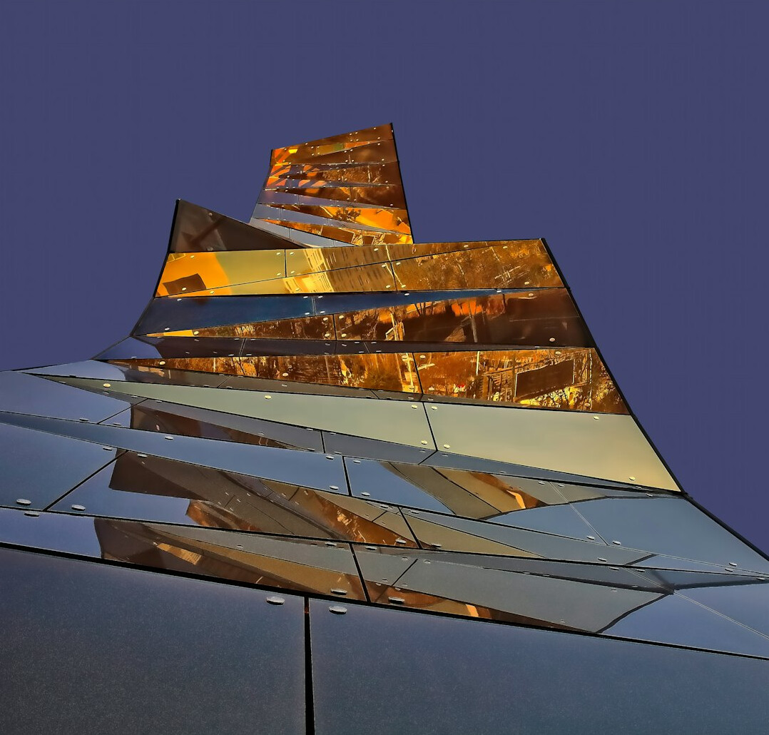 Abstract fragmented mirror reflecting light in muted tones